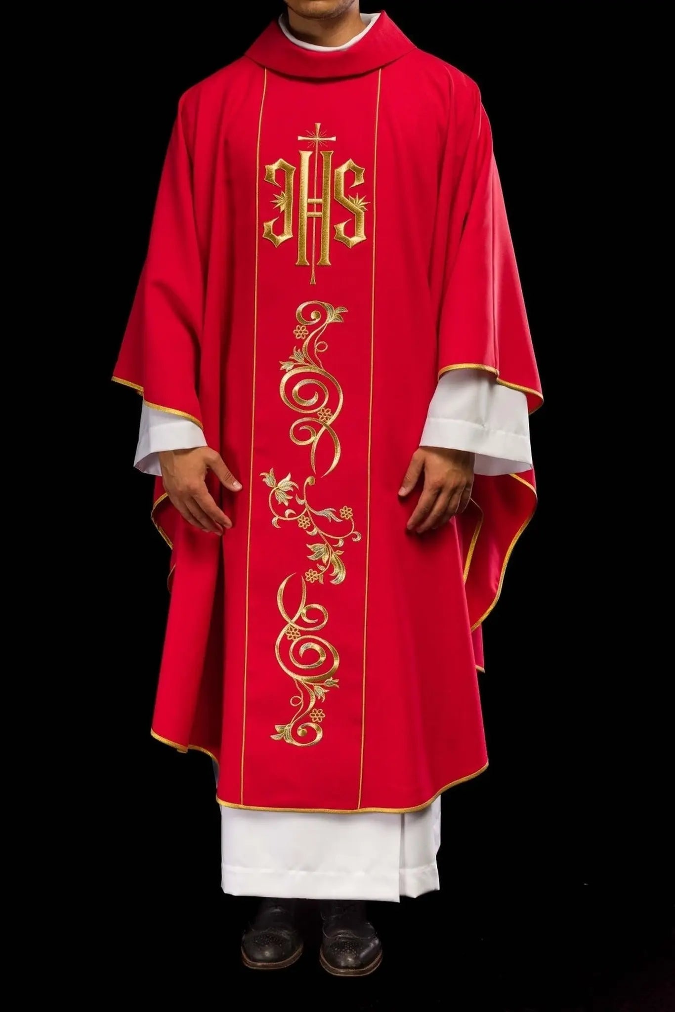 Red chasuble embroidered with IHS