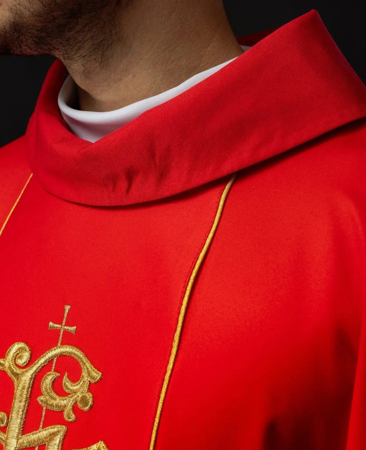 Red liturgical chasuble with richly decorated belt with floral motif and IHS