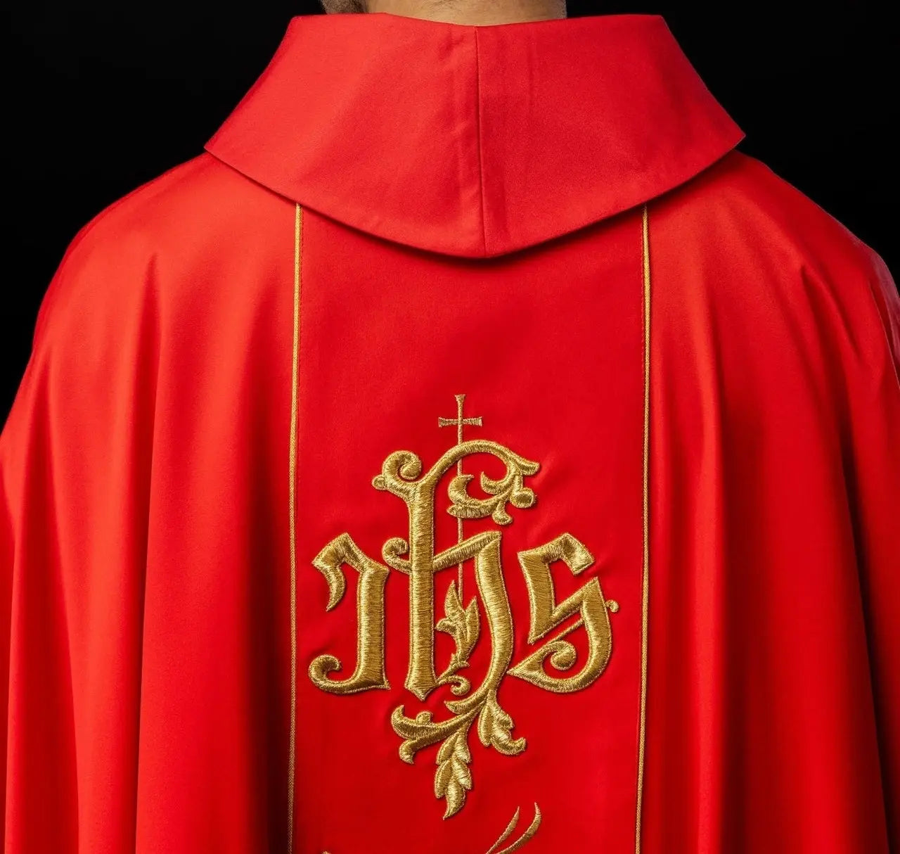 Red liturgical chasuble with richly decorated belt with floral motif and IHS