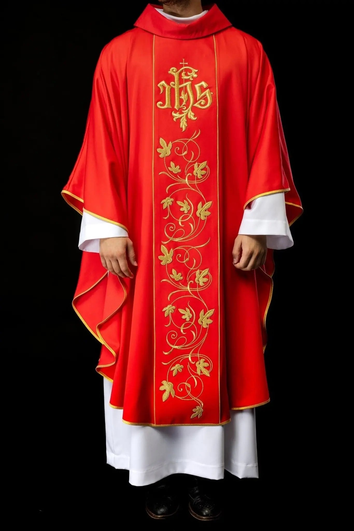 Red liturgical chasuble with richly decorated belt with floral motif and IHS