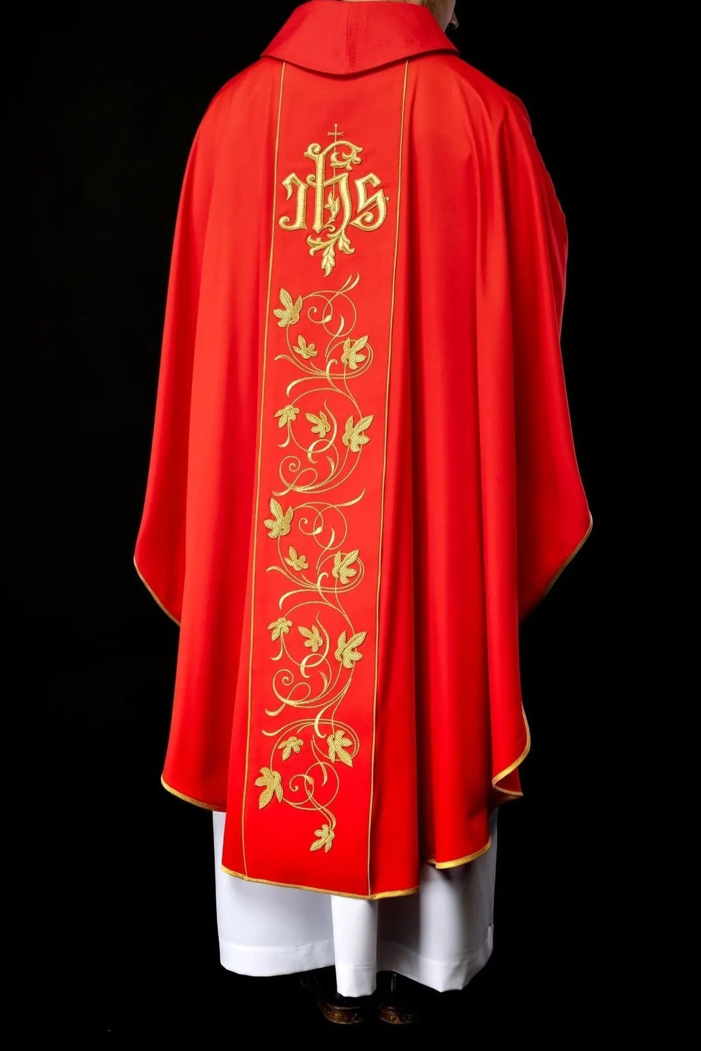 Red liturgical chasuble with richly decorated belt with floral motif and IHS