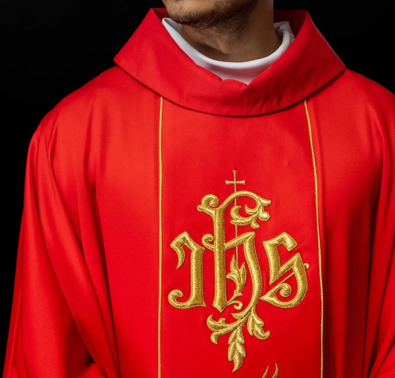 Red liturgical chasuble with richly decorated belt with floral motif and IHS
