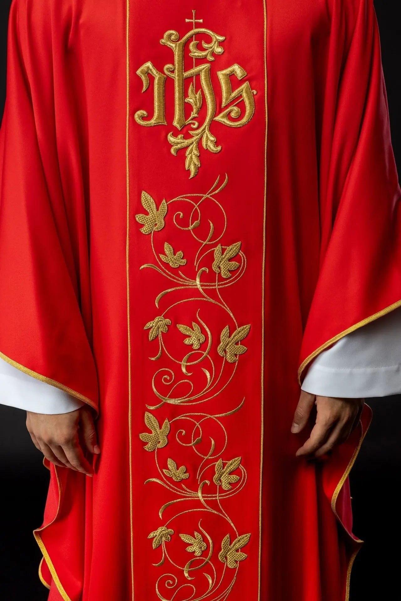 Red liturgical chasuble with richly decorated belt with floral motif and IHS