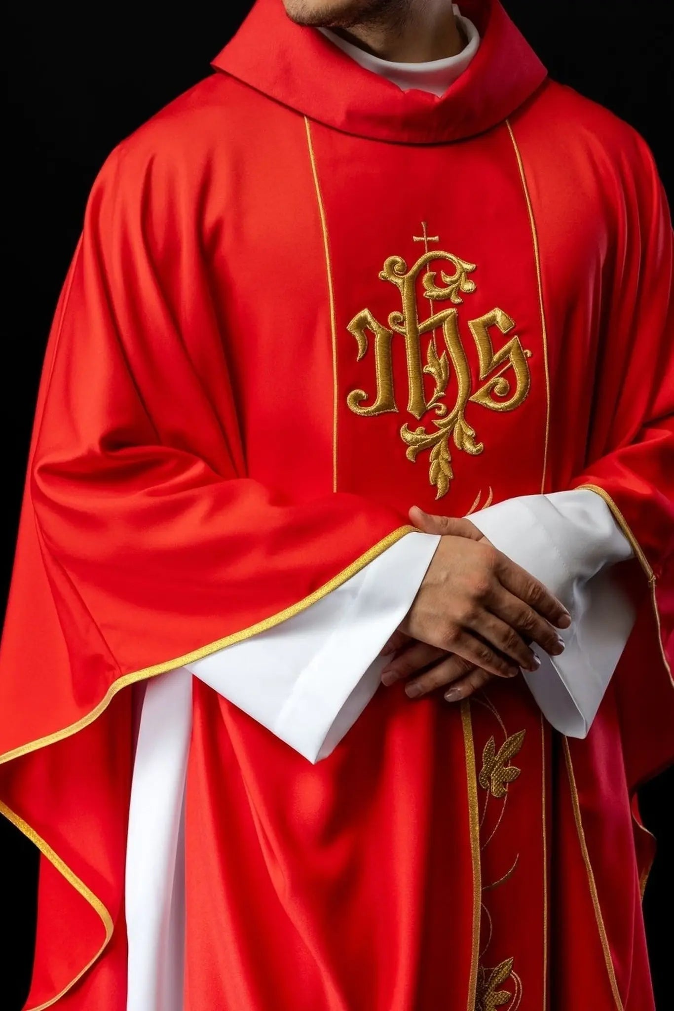 Red liturgical chasuble with richly decorated belt with floral motif and IHS