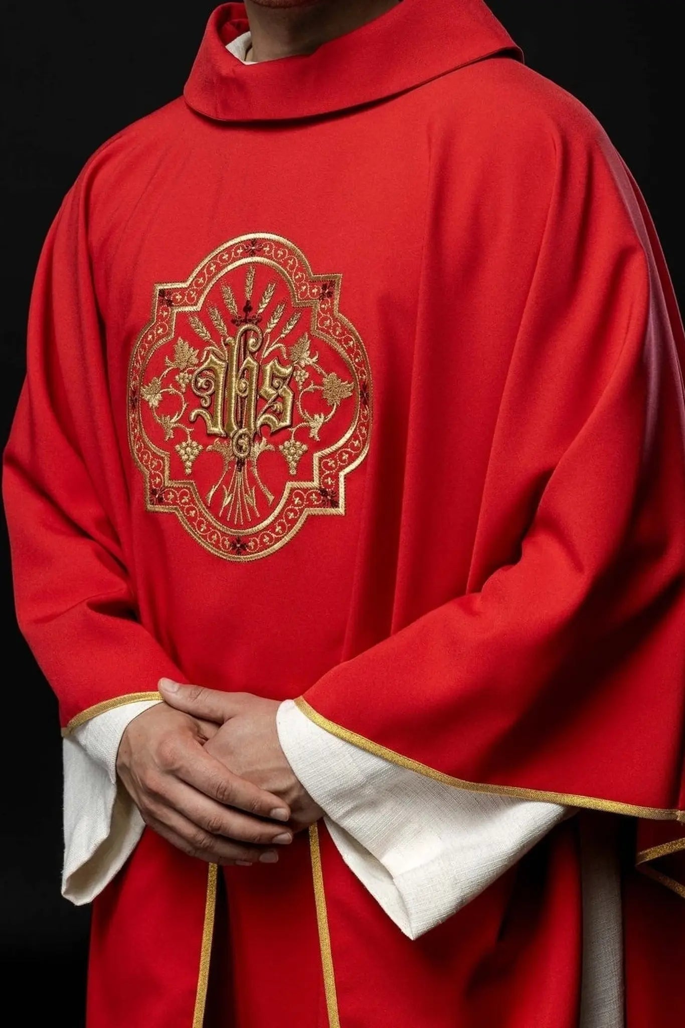 Red chasuble with IHS and PAX embroidery