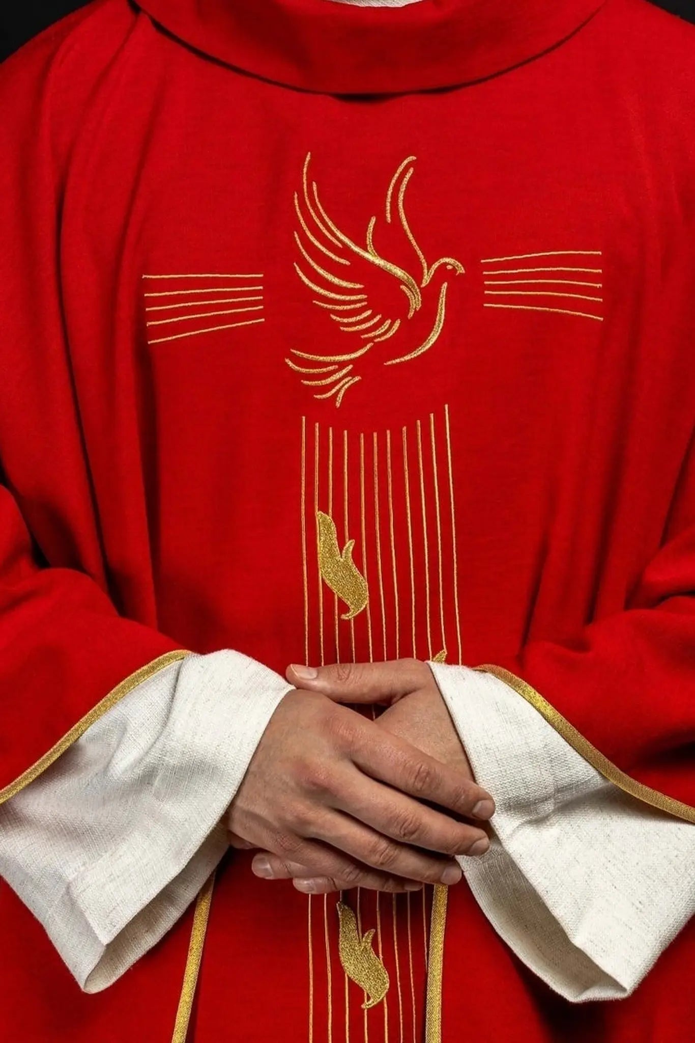 Red chasuble with gold trim and Holy Spirit embroidery
