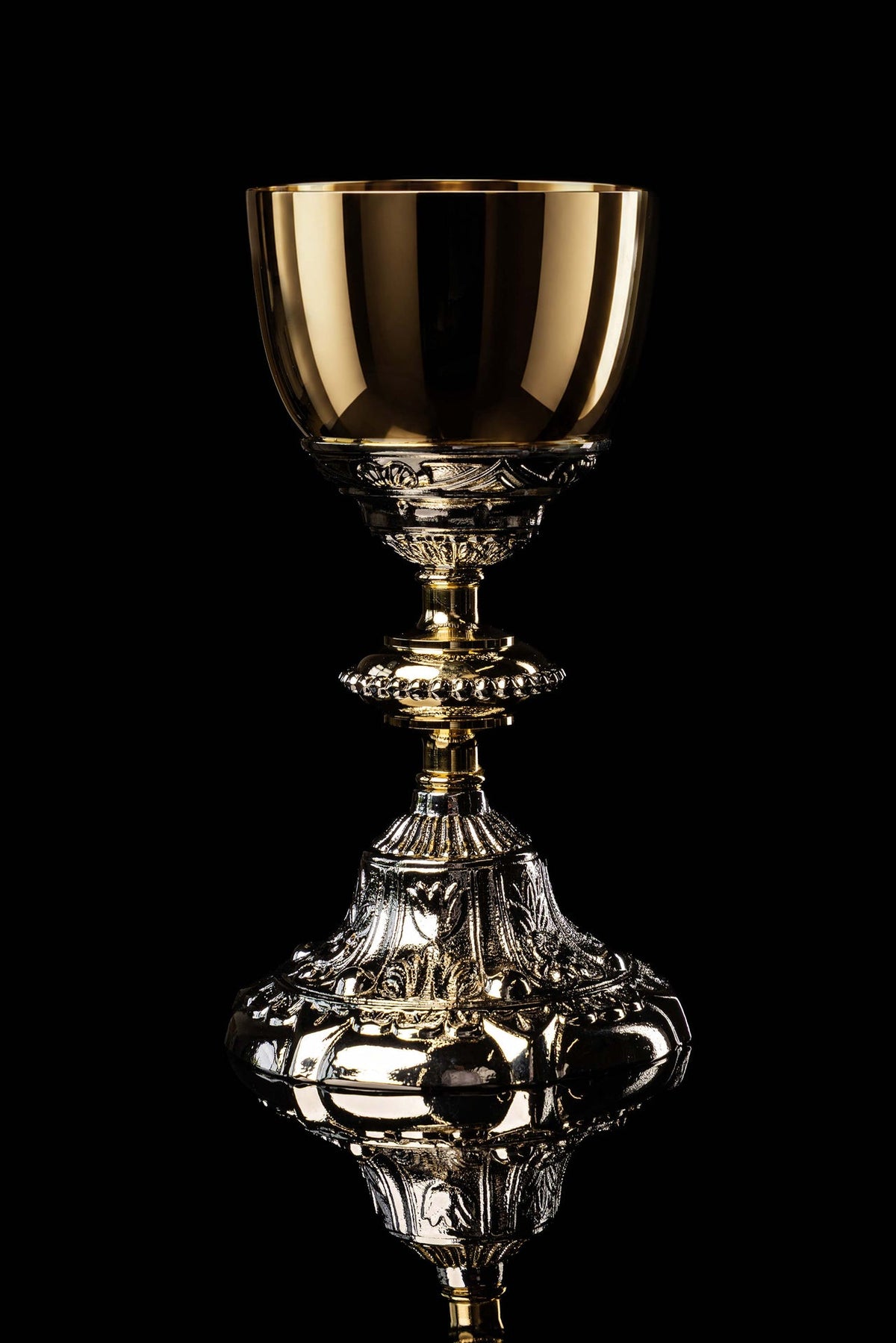 Gold and silver chalice with relief plant motifs, full front view