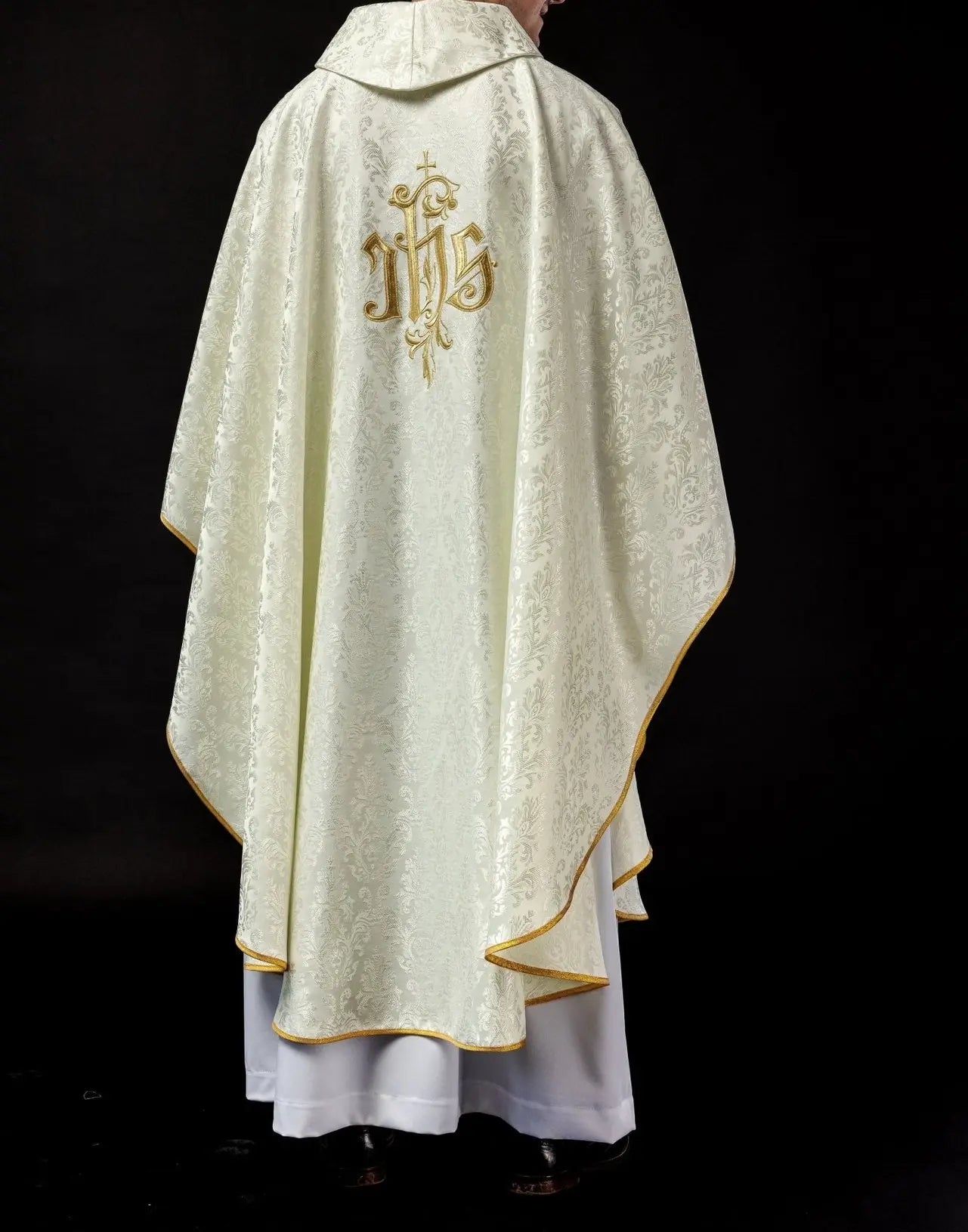 Ecru chasuble with embroidered IHS motif on decorative fabric