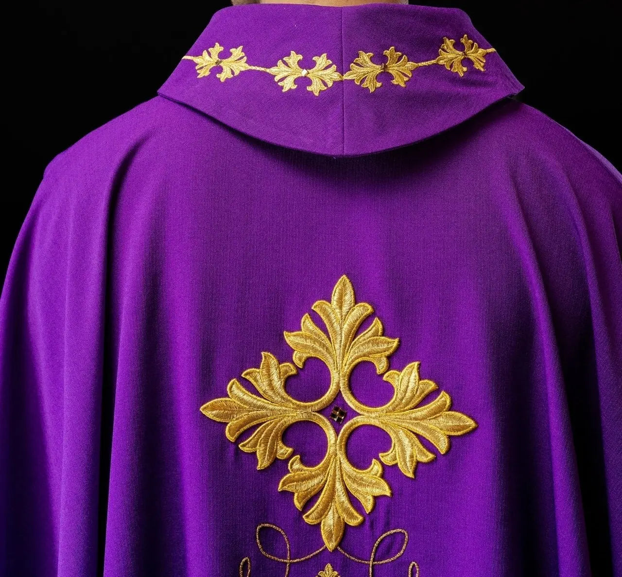 Purple chasuble richly embroidered with string and stones