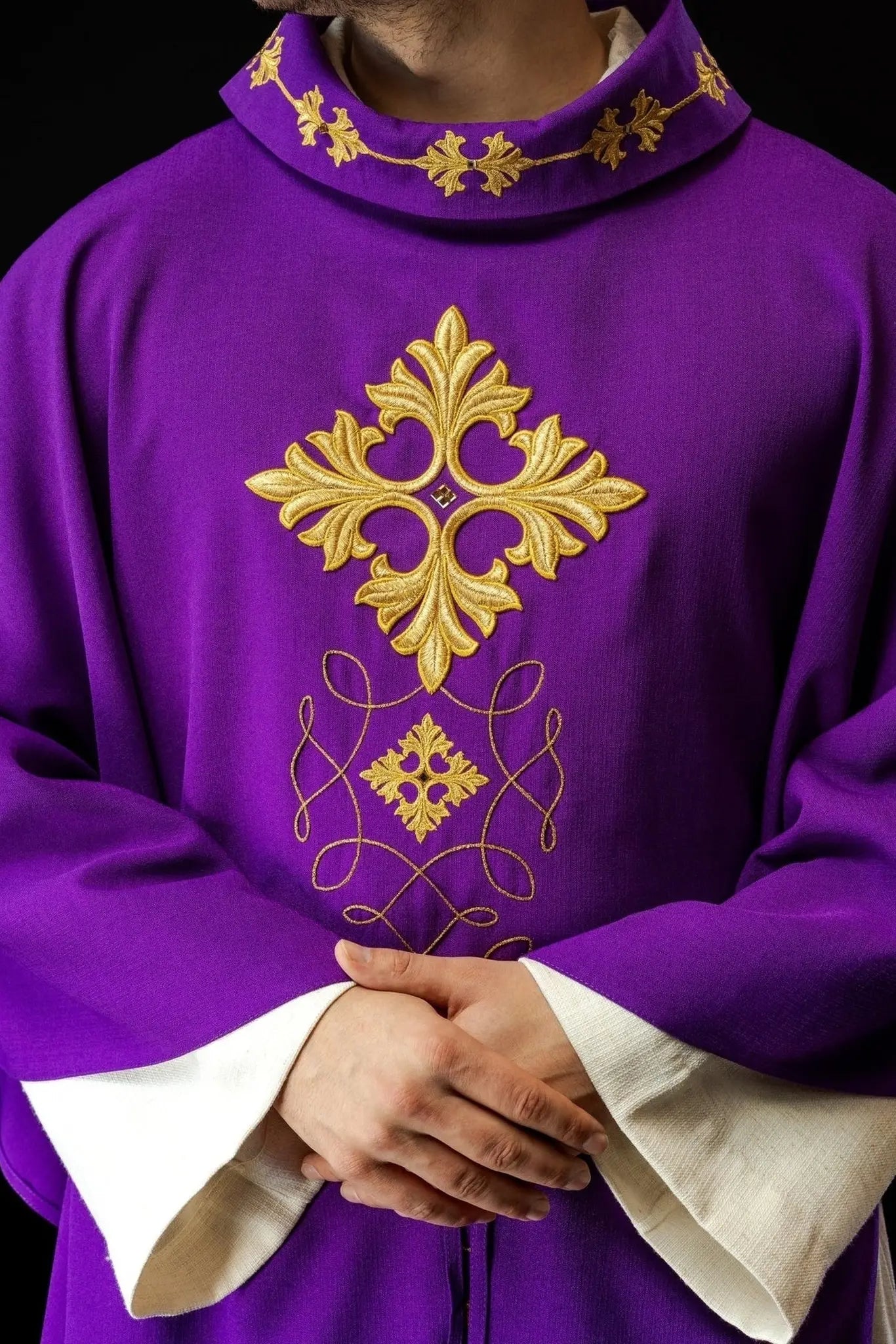 Purple chasuble richly embroidered with string and stones