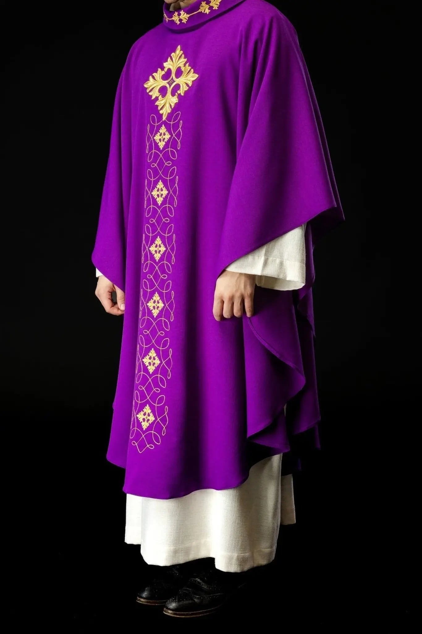 Purple chasuble richly embroidered with string and stones