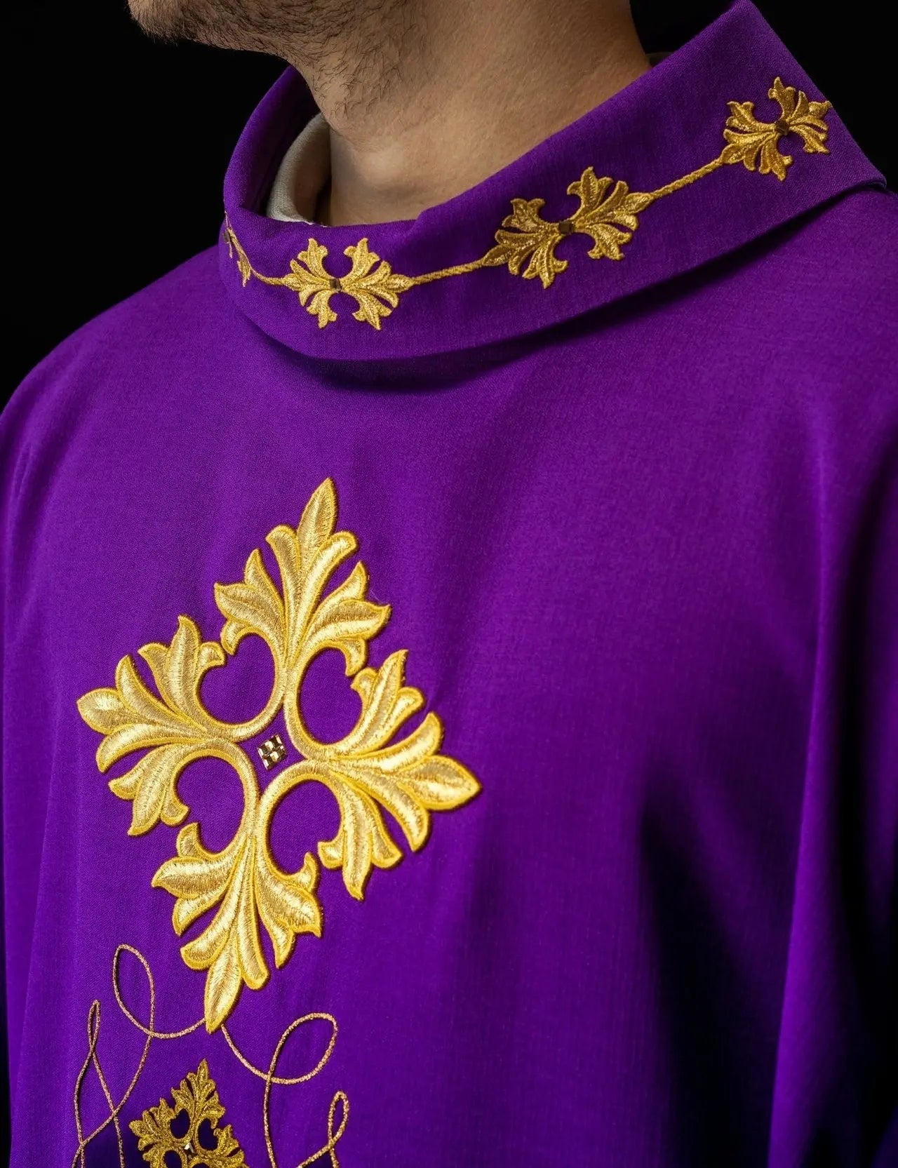 Purple chasuble richly embroidered with string and stones