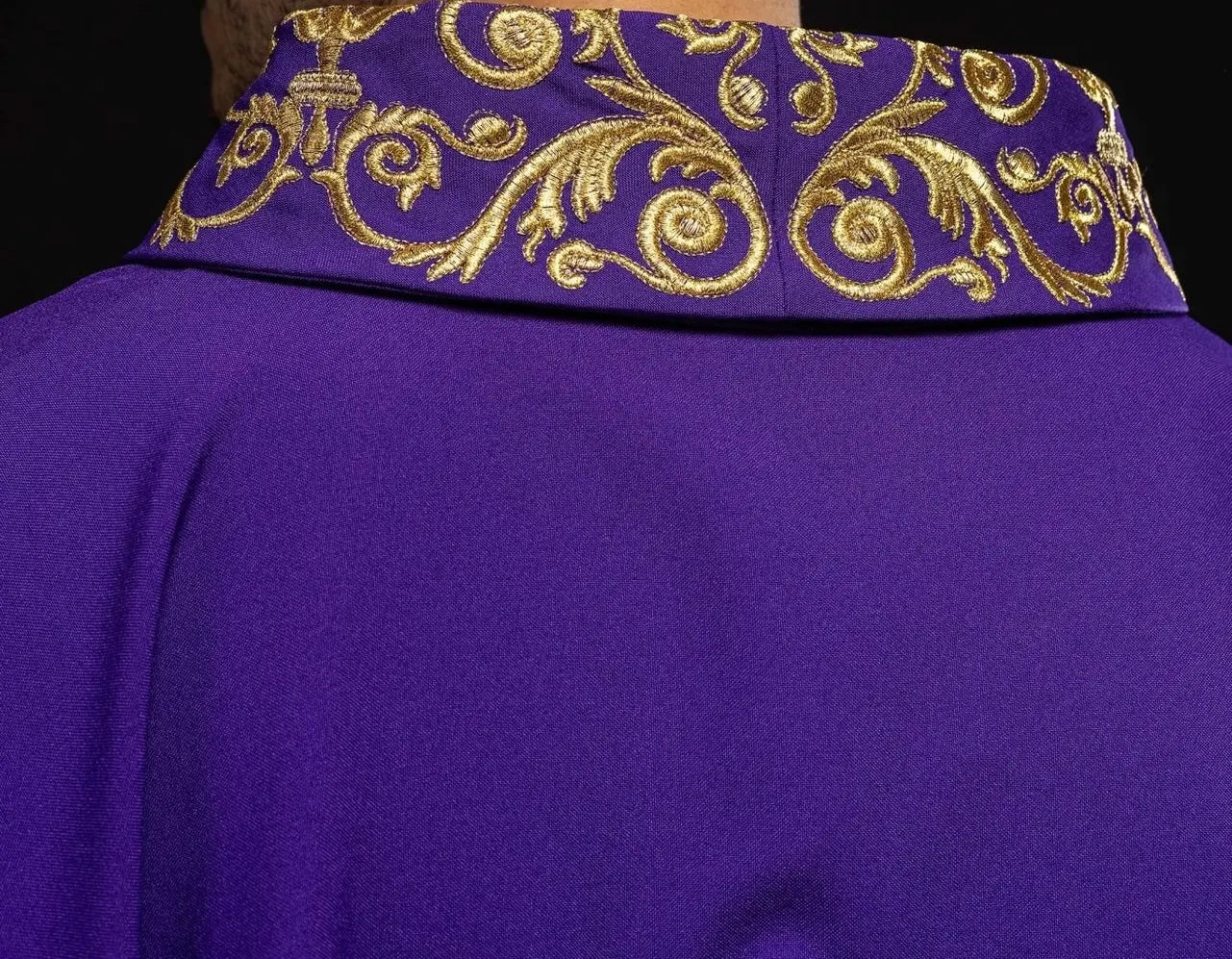 Purple chasuble with gold IHS embroidery and decorative trim