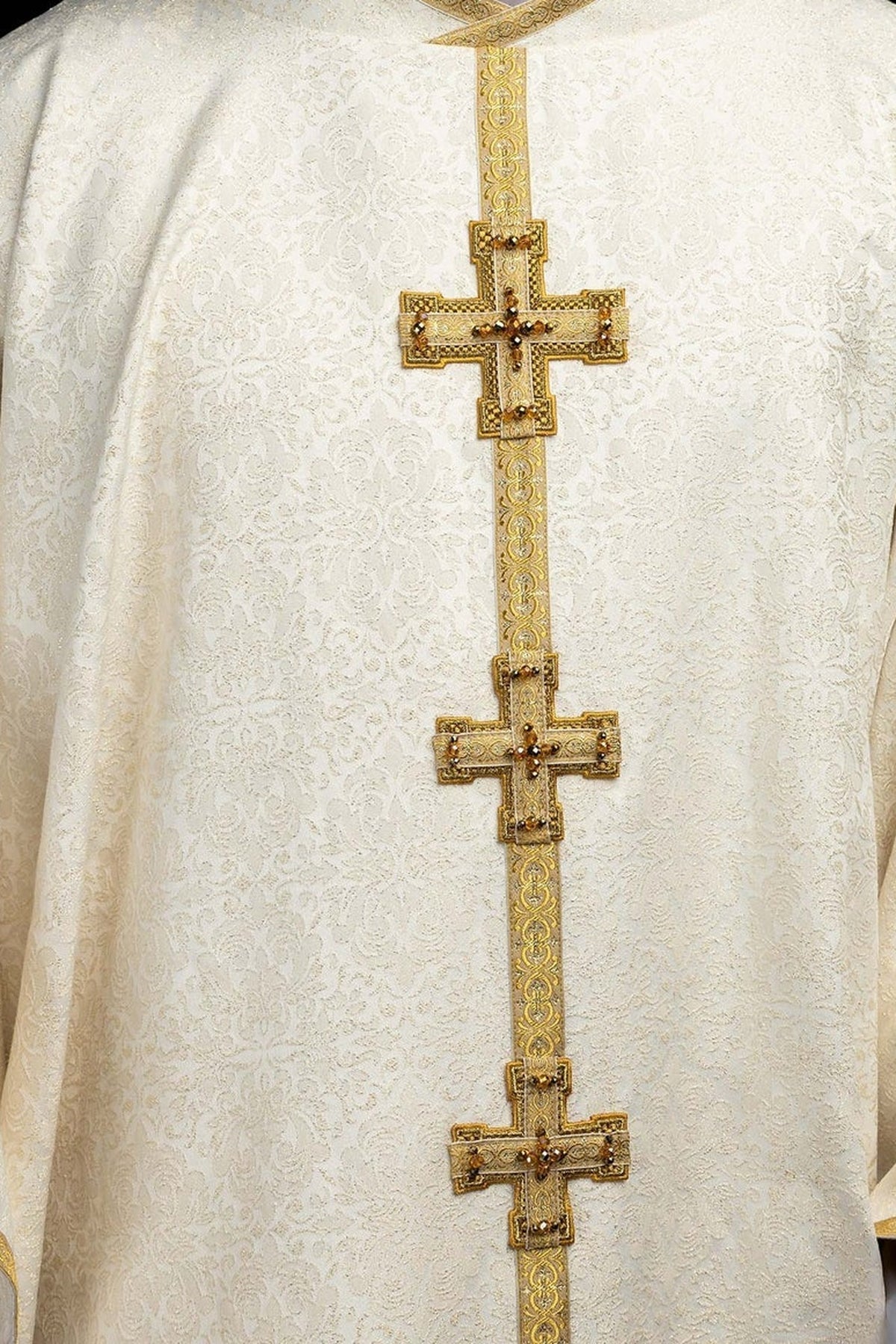 Ecru chasuble with dimensional crosses and natural stones, front cross close-up
