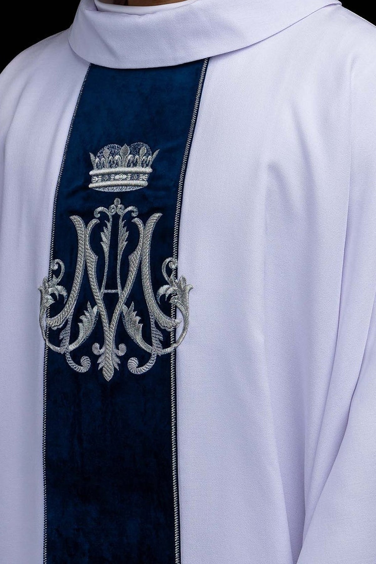 White chasuble with embroidered crowned Marian monogram, front detail