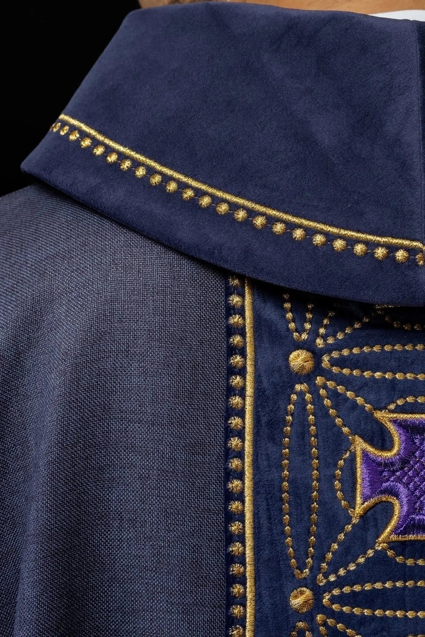 Liturgical chasuble with richly decorated belt with crosses in purple color