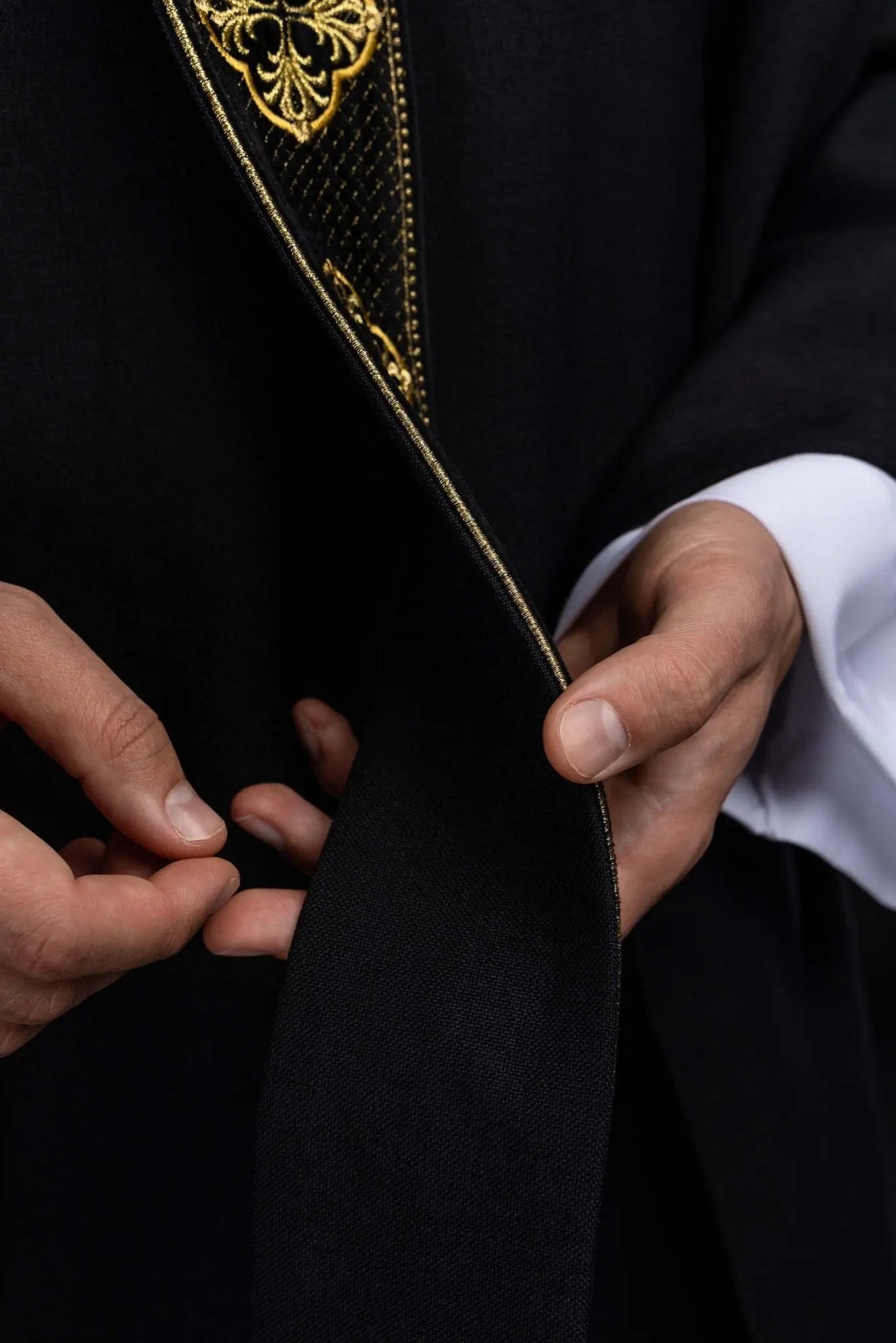 Black chasuble with embroidered band and collar with crosses