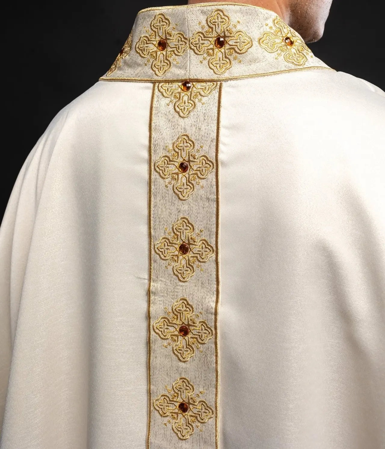 Chasuble in ecru color with embroidered belt and collar decorated with stones