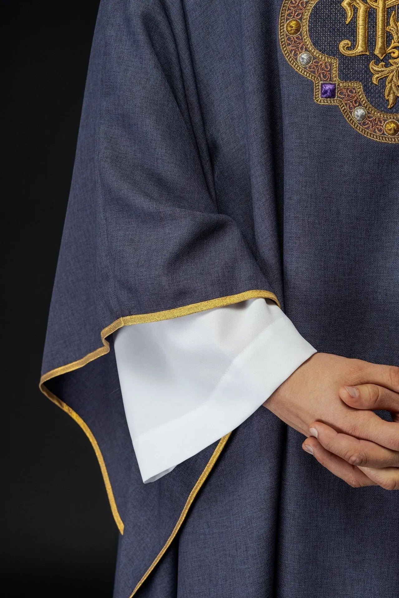 Chasuble with richly embroidered belt and piping around IHS I collar embroidery in purple color