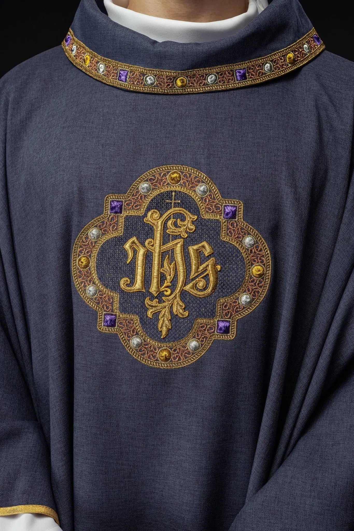 Chasuble with richly embroidered belt and piping around IHS I collar embroidery in purple color