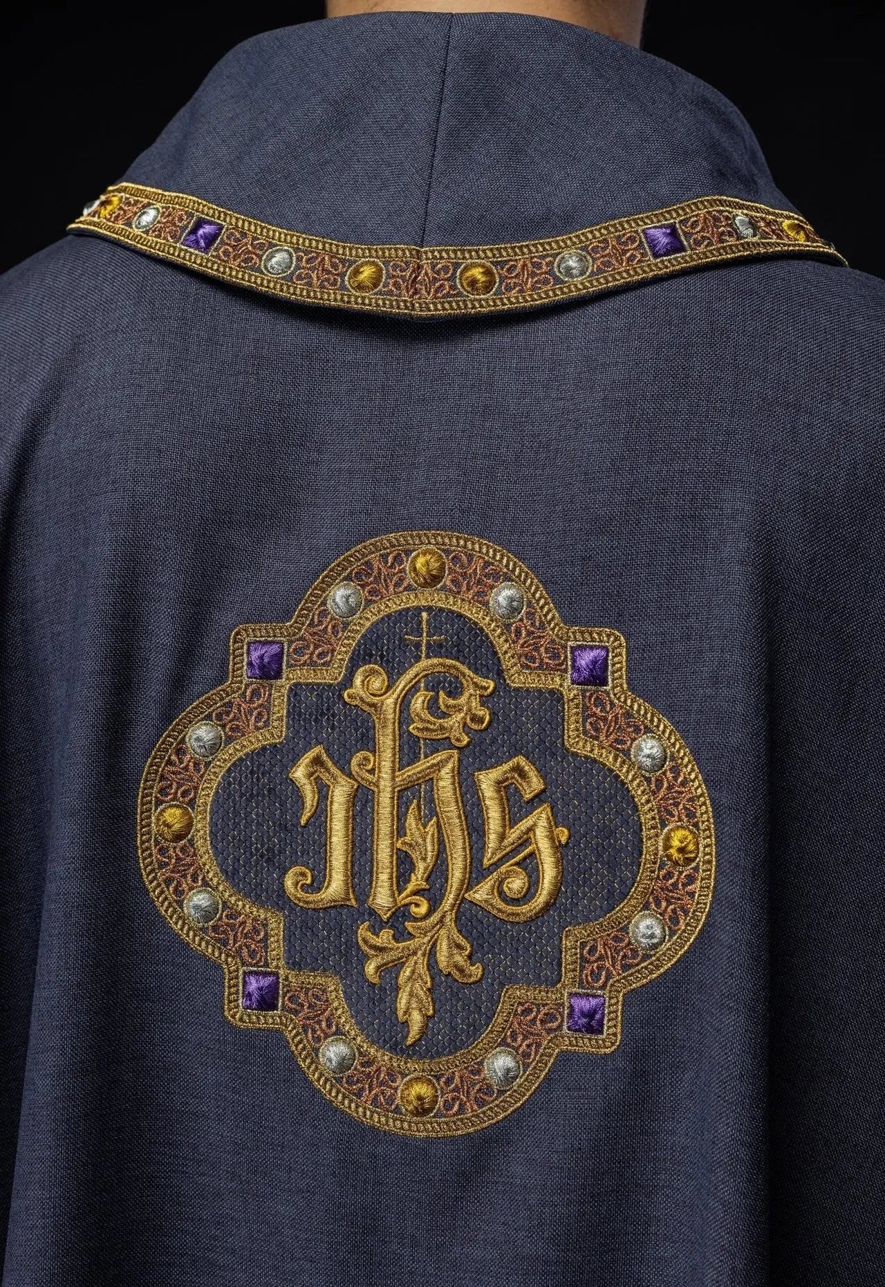 Chasuble with richly embroidered belt and piping around IHS I collar embroidery in purple color