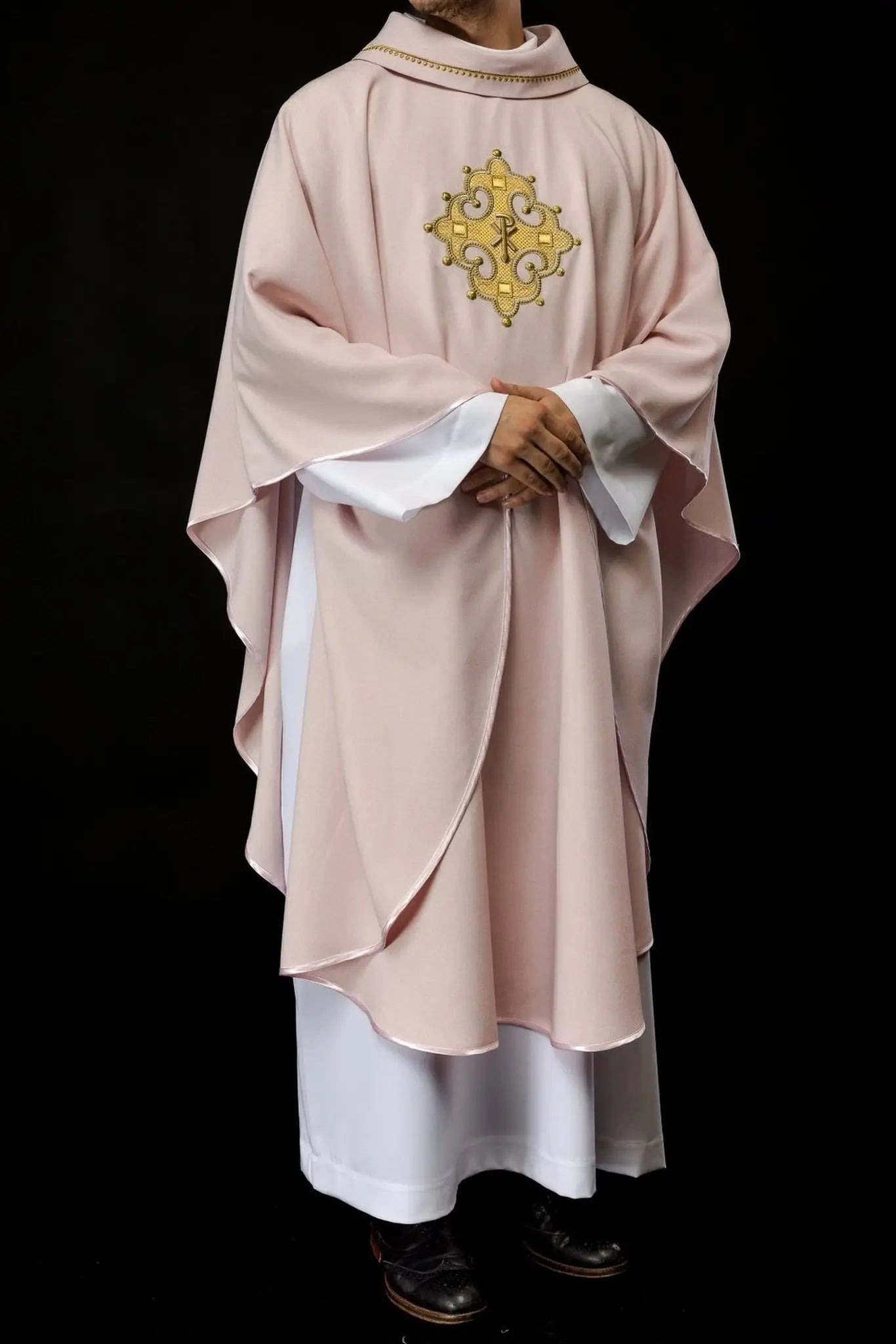 Chasuble with embroidered cross and gold trim on collar in rose color