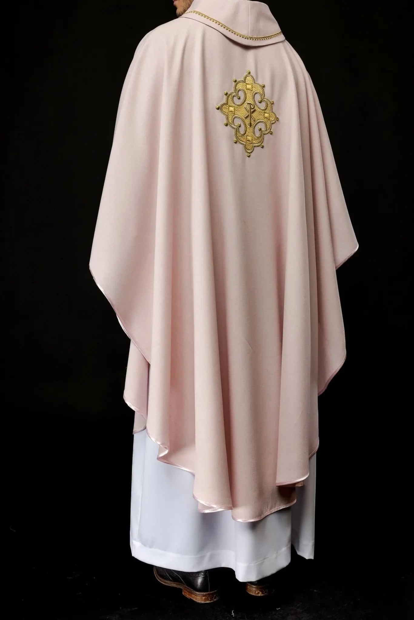 Chasuble with embroidered cross and gold trim on collar in rose color