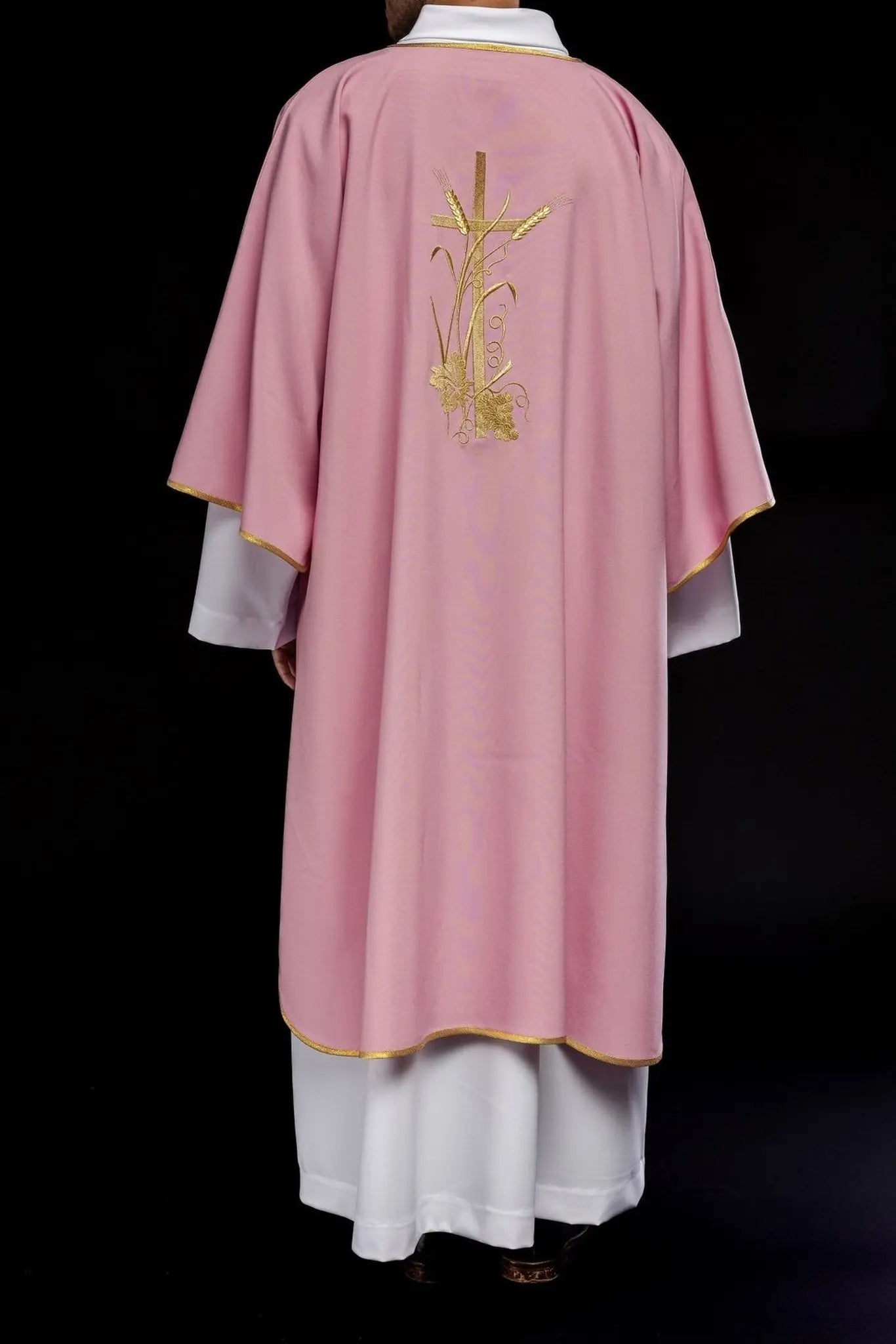 Pink dalmatica with gold Pax cross embroidery