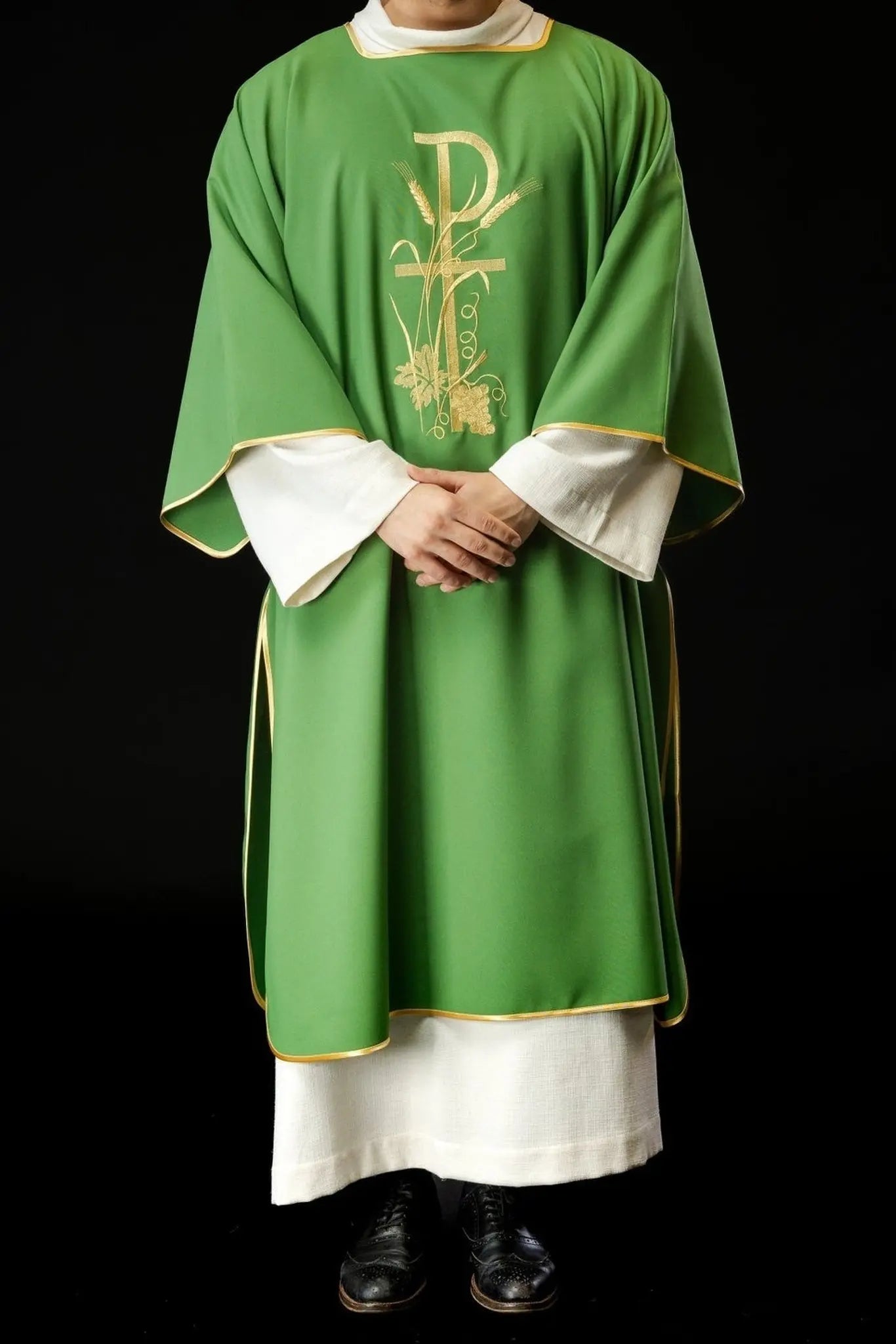 Green dalmatics with gold Pax cross embroidery