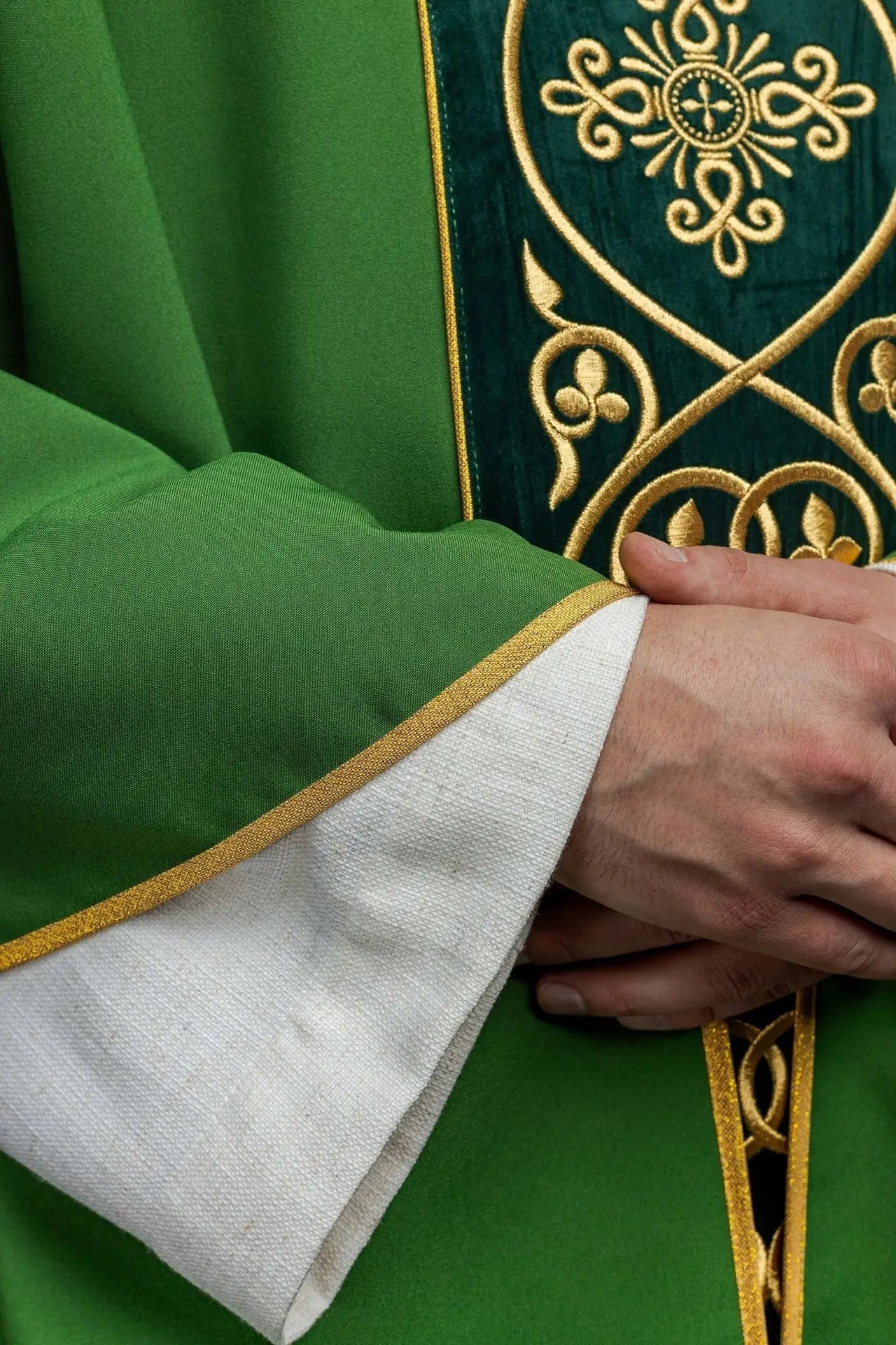 Green liturgical chasuble decorated with embroidery on velvet