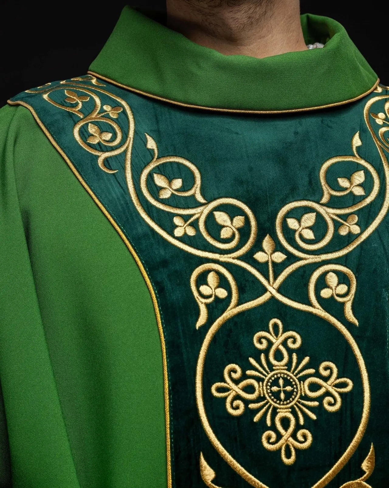Green liturgical chasuble decorated with embroidery on velvet