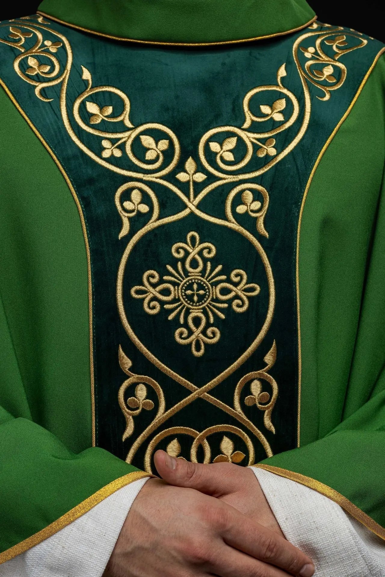 Green liturgical chasuble decorated with embroidery on velvet