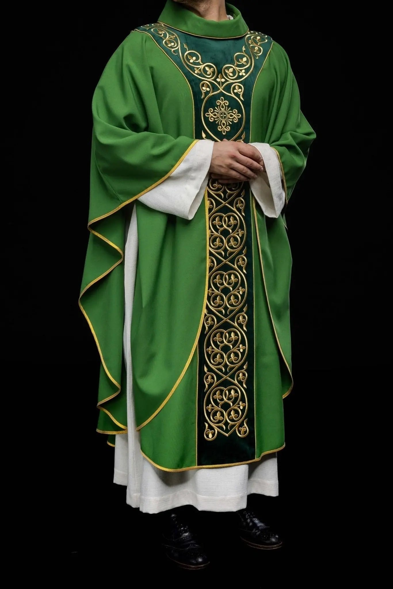 Green liturgical chasuble decorated with embroidery on velvet