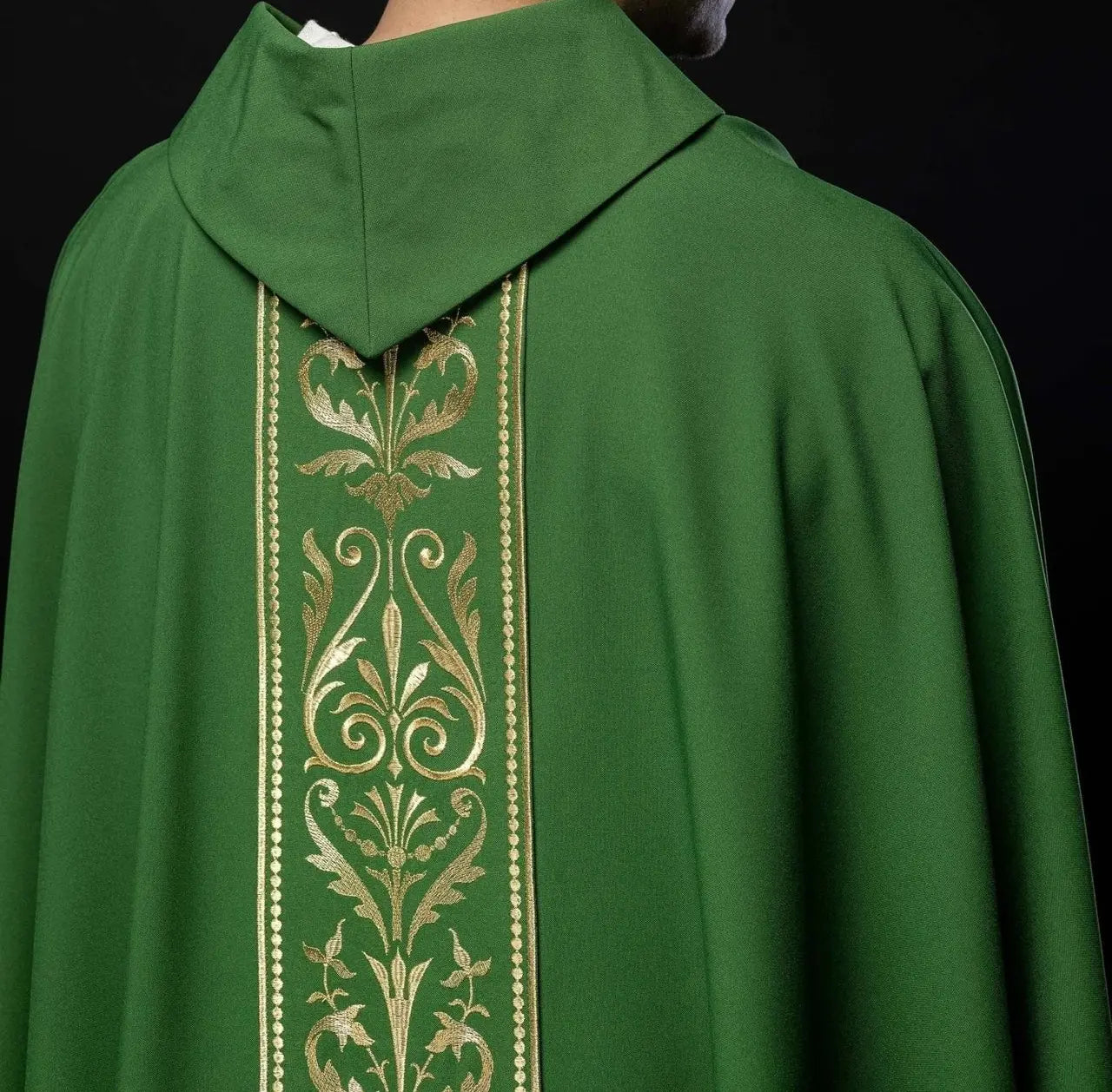 Green liturgical chasuble decorated with gold embroidered belt