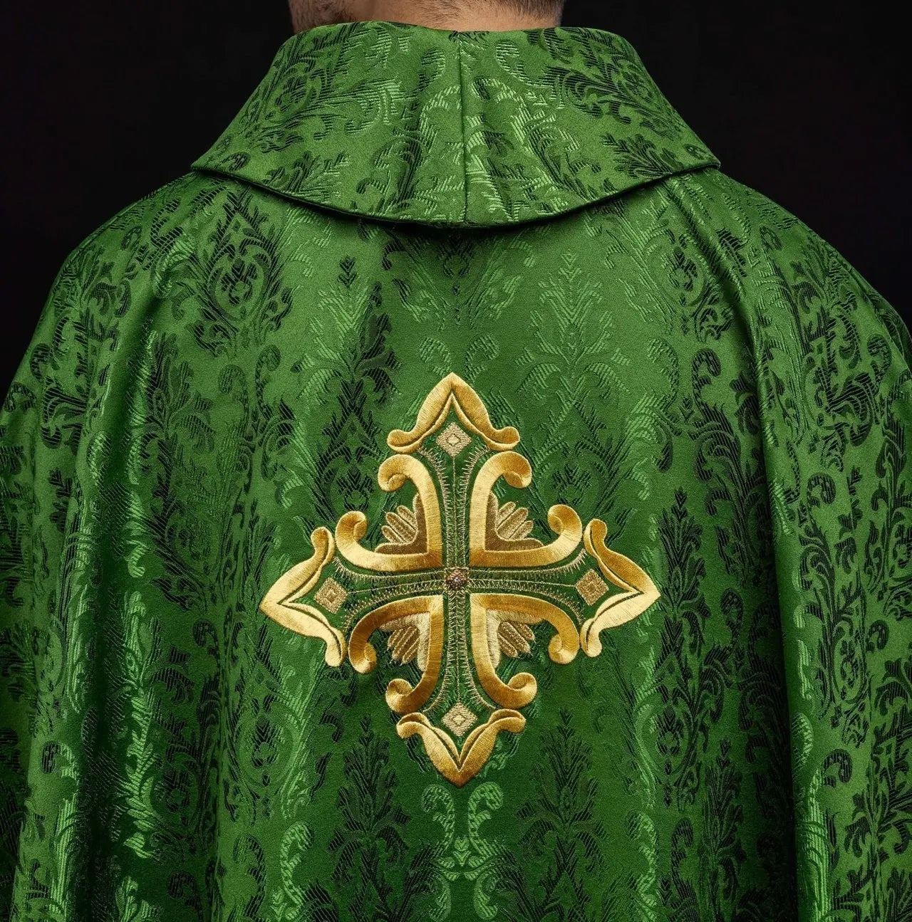 Green chasuble with cross sewn from patterned fabric