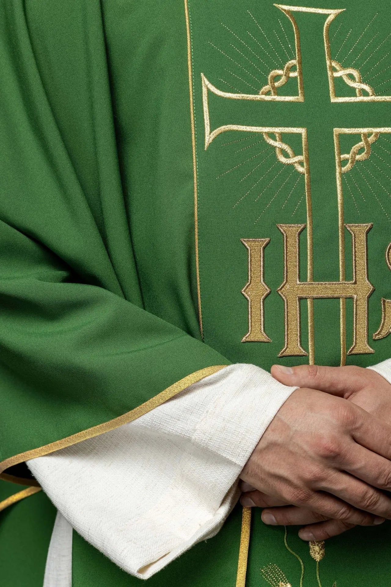 Green chasuble with decorated gold belt with IHS and ears