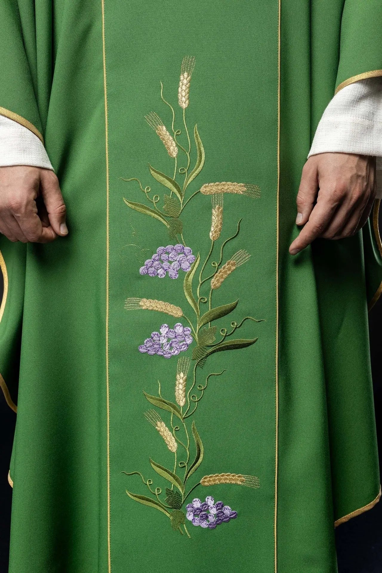 Green chasuble with decorated gold belt with IHS and ears