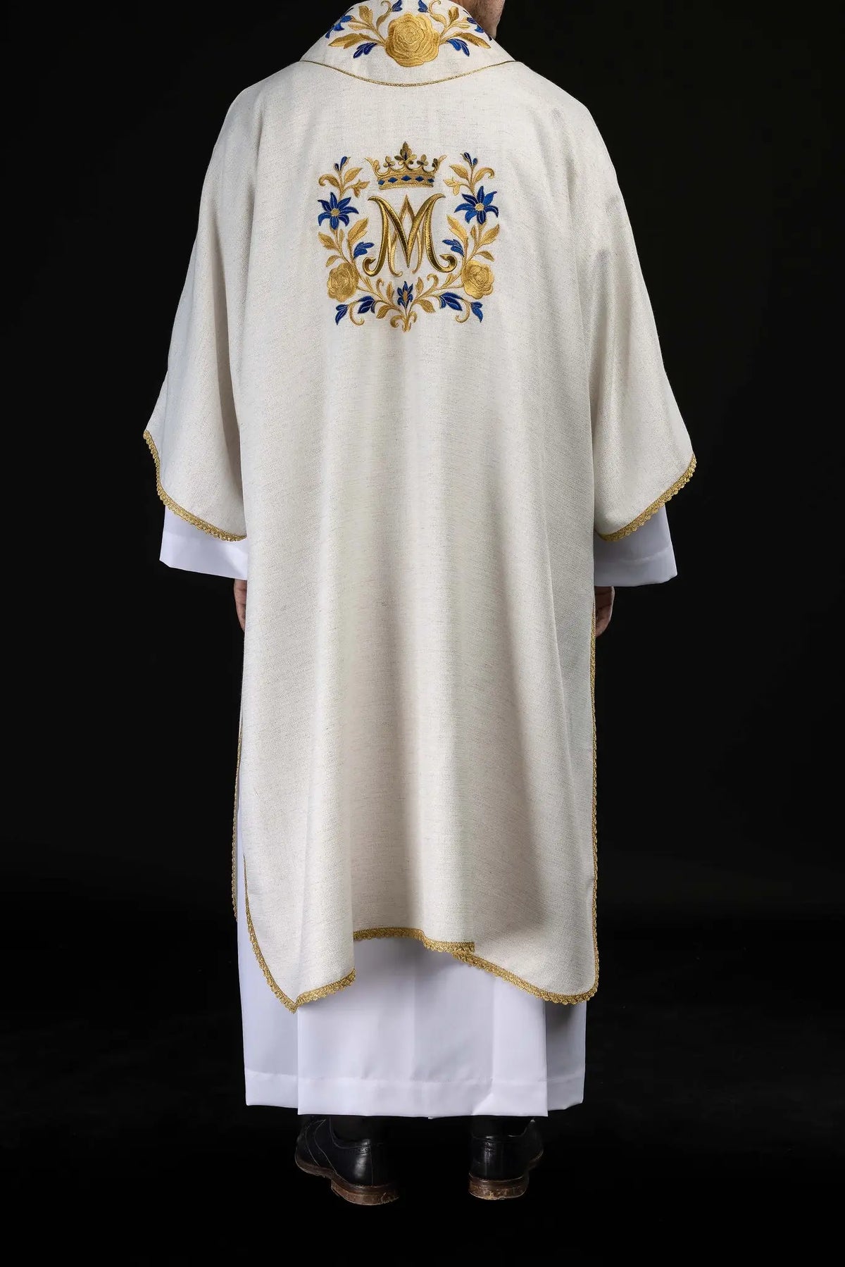 Ecru dalmatic with embroidered M monogram and gold trim, rear view