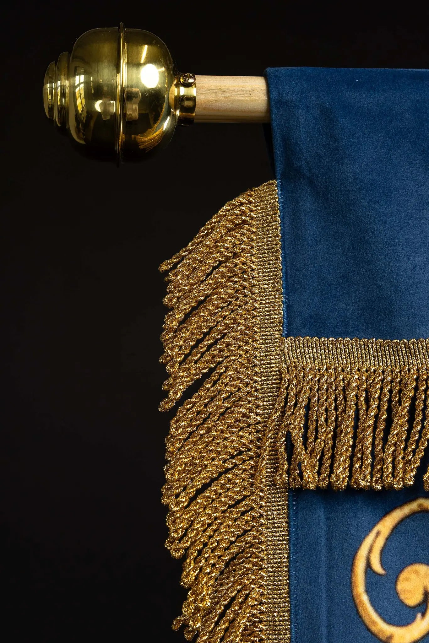 Double-sided blue processional banner with an image of Our Lady of the Immaculate Conception on one side and a Marian monogram on the other, both surrounded by gold floral ornamentation and finished with gold fringes.