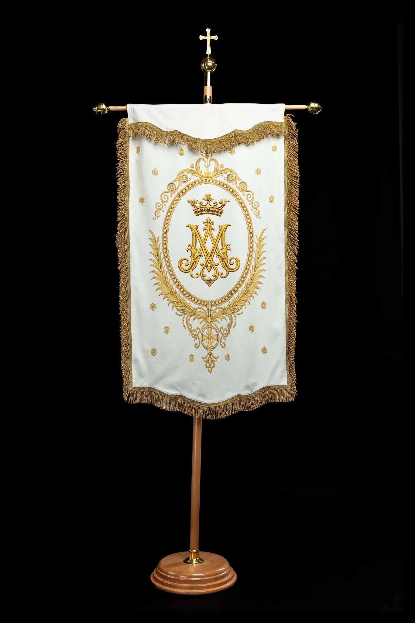 Double-sided processional banner with Our Lady of the Assumption on one side and a Marian monogram on the other, made of velour fabric with gold ornaments and fringes.