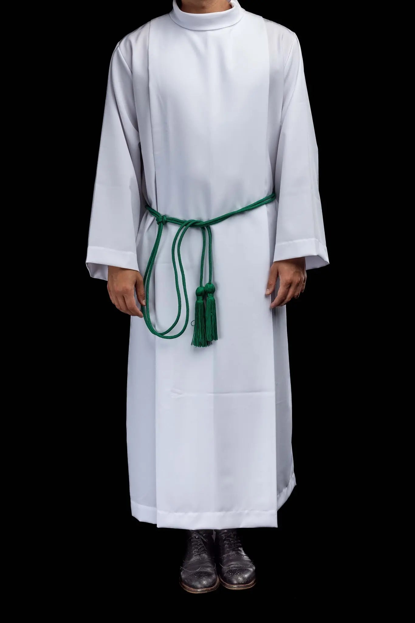 Green liturgical cincture with decorative tassels, made from braided cord.