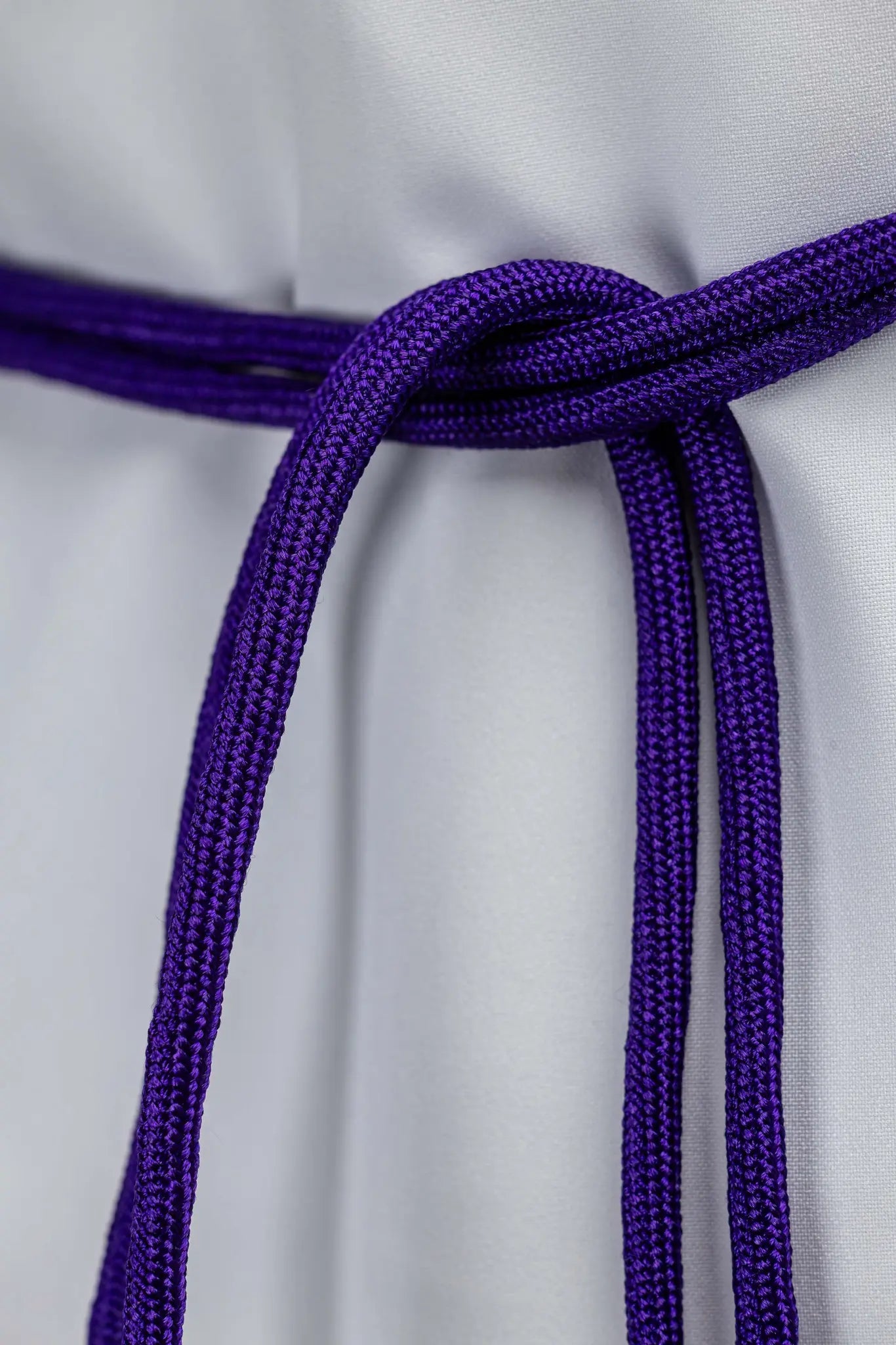Purple braided liturgical cincture with long tassels