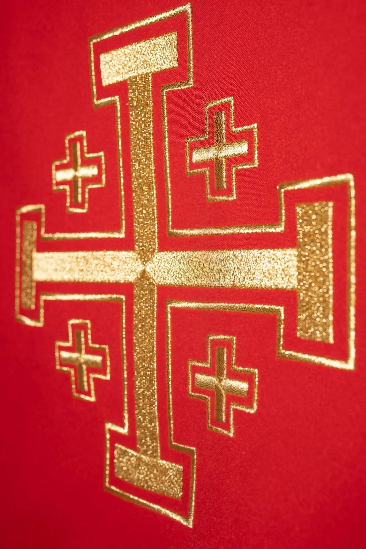 Red chasuble embroidered with cross motif