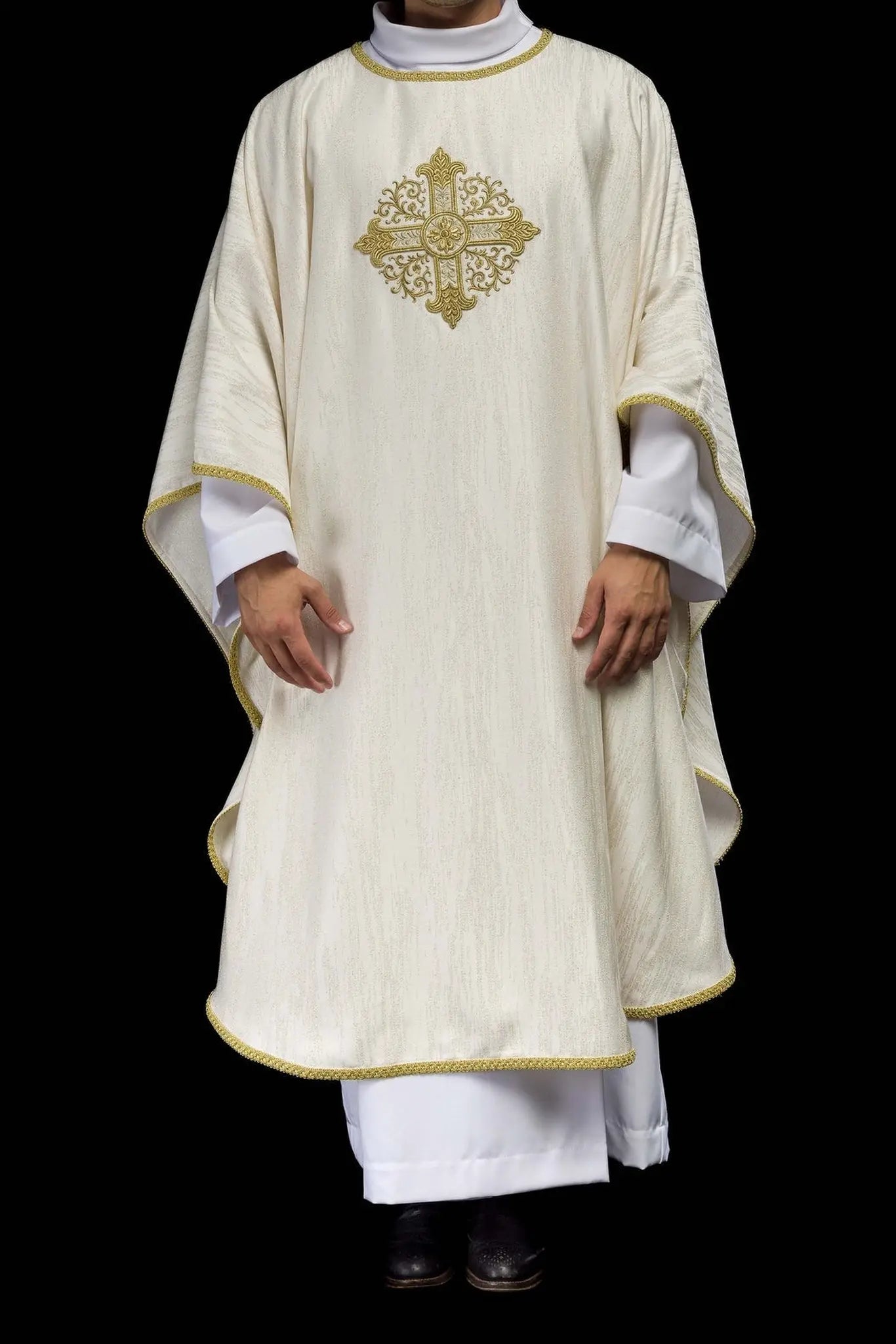Ecru chasuble with embroidered cross motif on decorative fabric