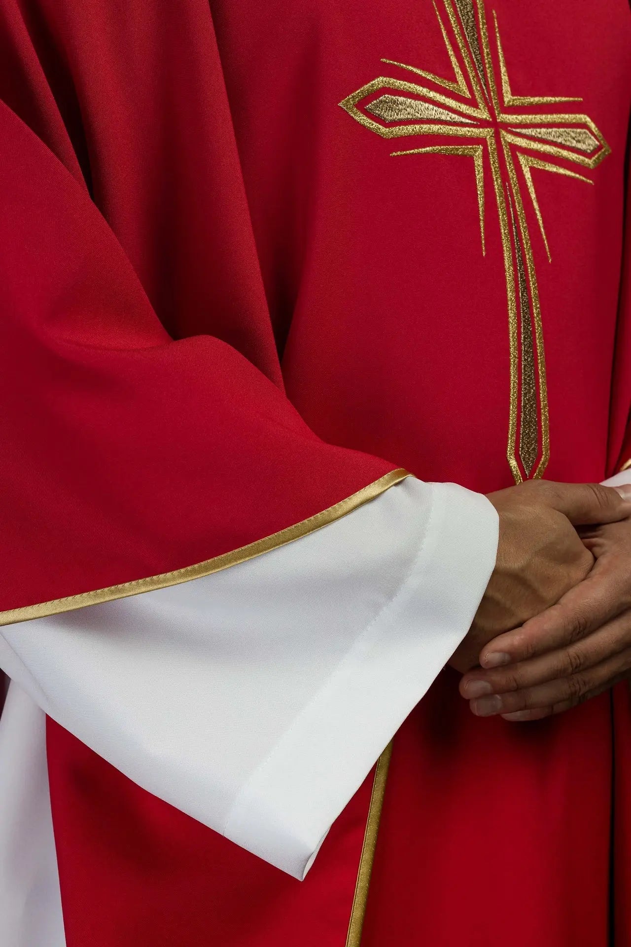 Red chasuble embroidered with cross design