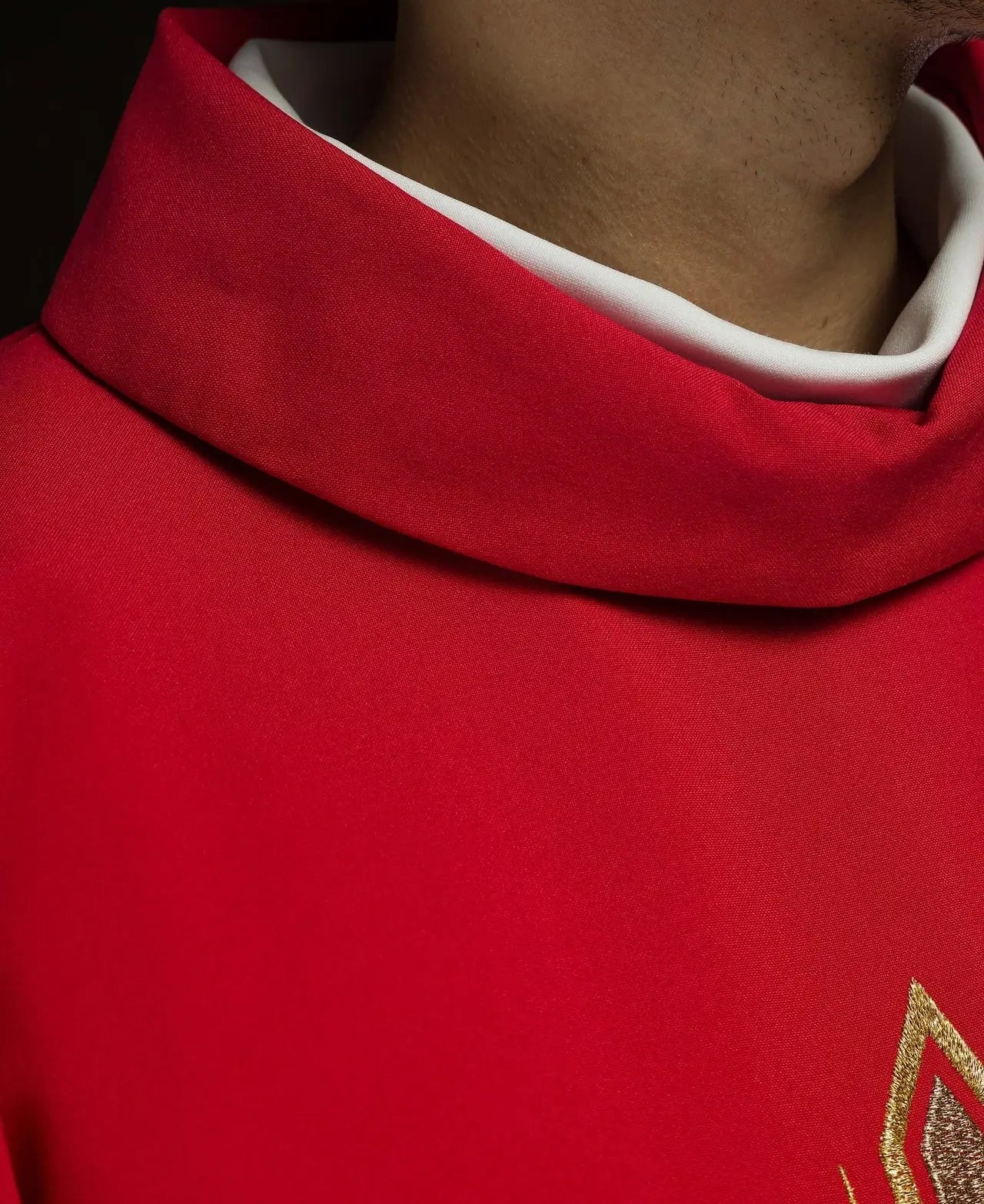 Red chasuble embroidered with cross design