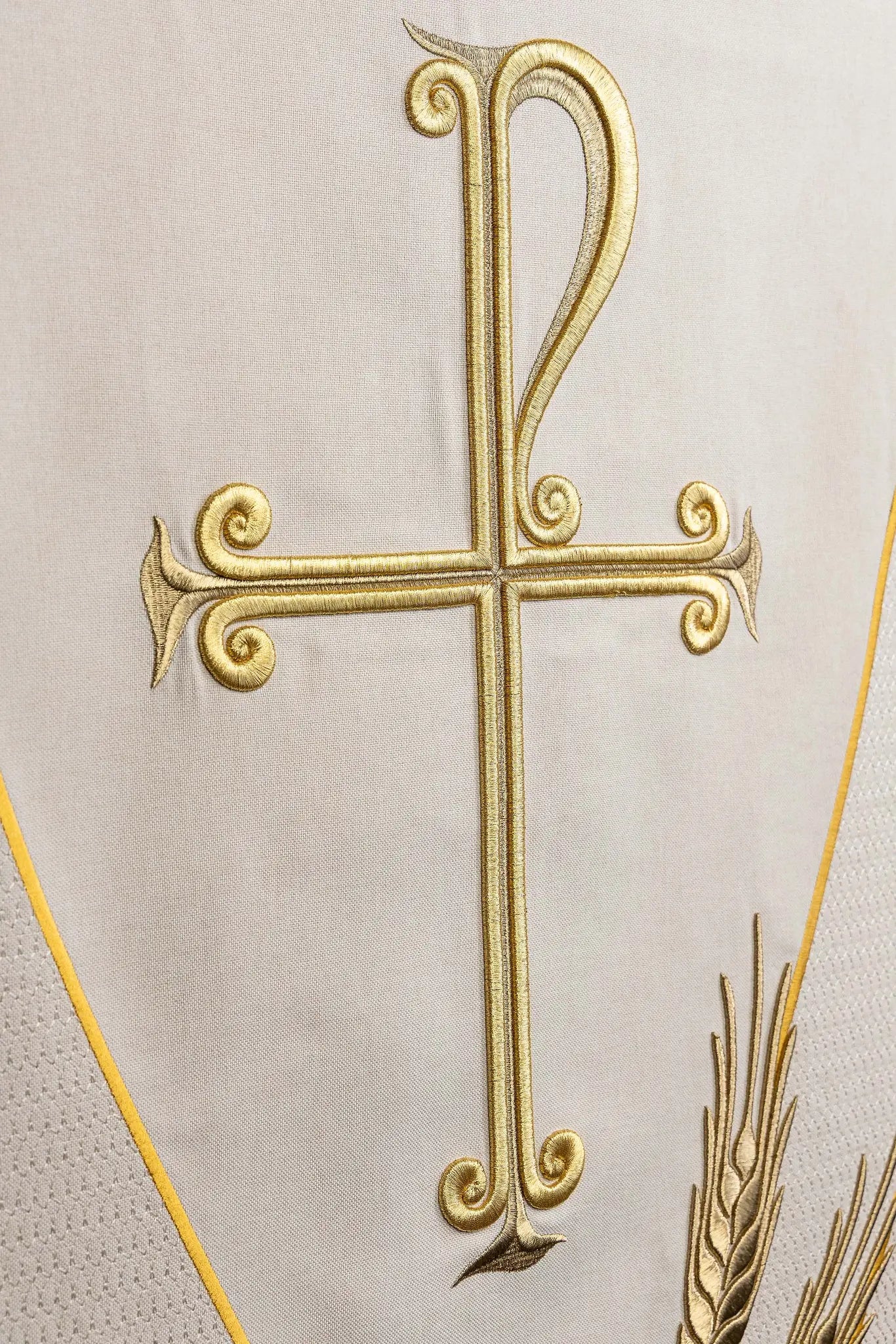 Ecru lectern cover with gold embroidered Chi-Rho symbol (cross with P) and wheat sheaves, suitable for liturgical use.