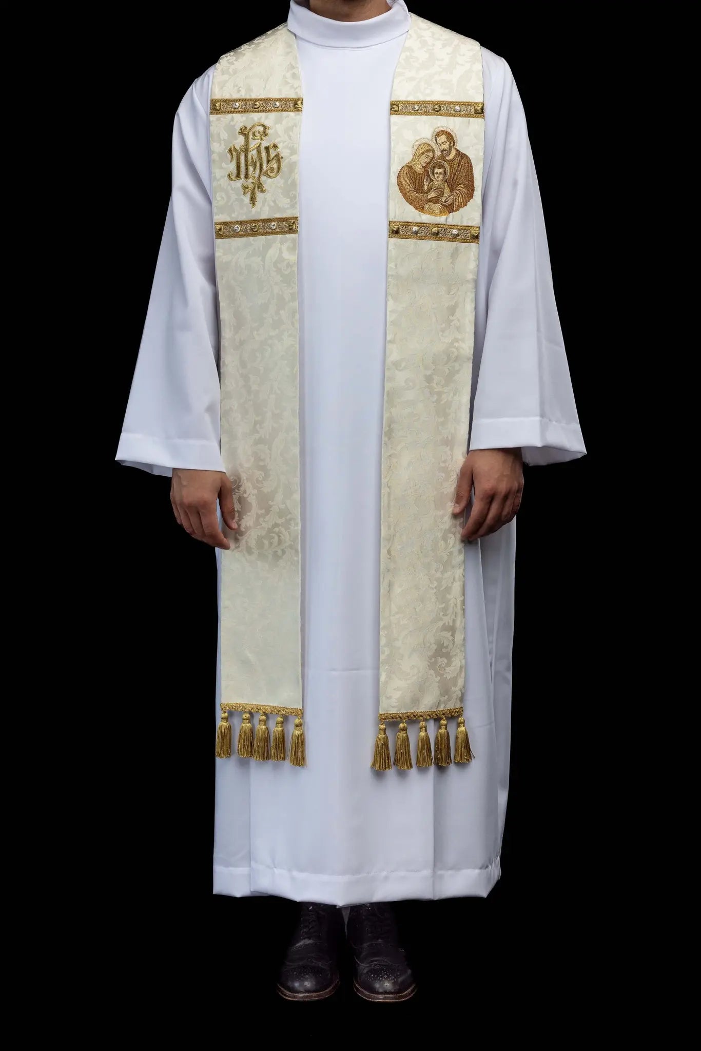 Ecru stole with Holy Family image on one side and IHS monogram on the other, featuring gold trim and tassels.