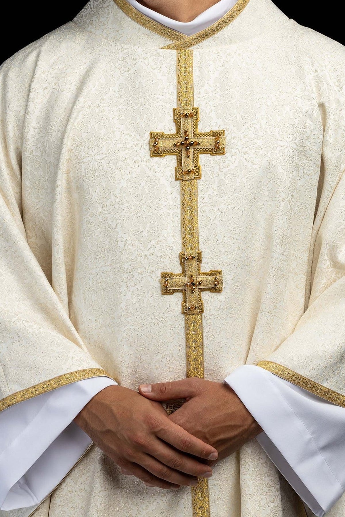 Ecru chasuble with dimensional crosses and natural stones, upper front view