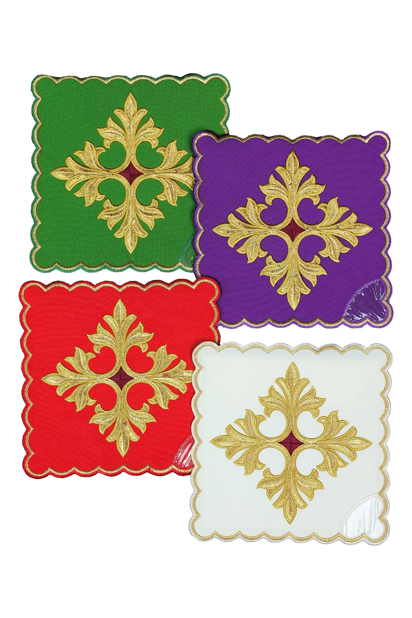 Set of four liturgical palls in green, purple, red, and white, each with a gold embroidered cross and floral ornament.